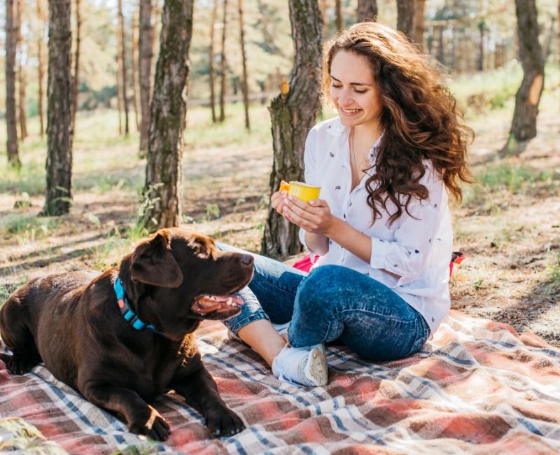 Woman, dog, mug, picnic.